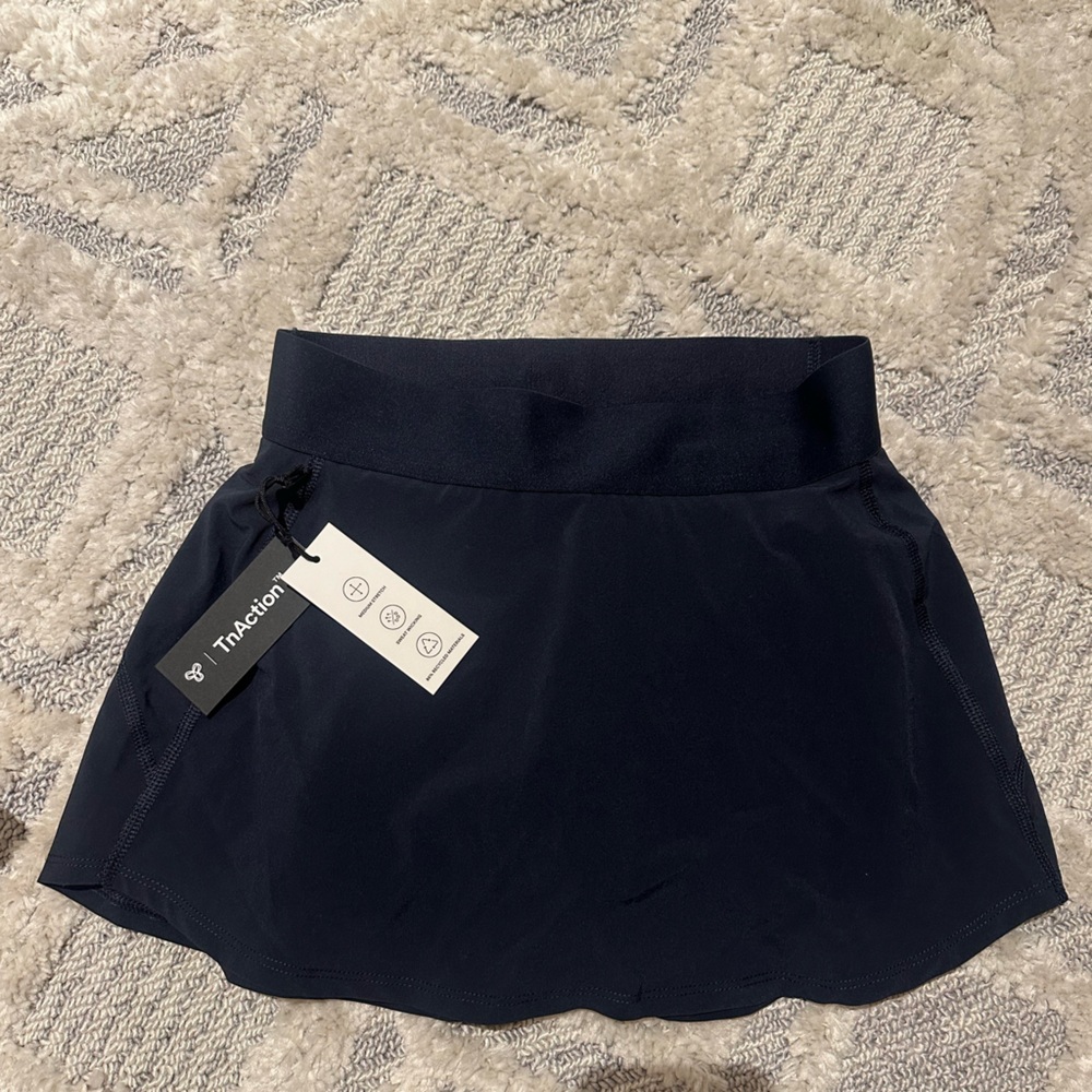 Aritzia TNA tennis skirt in navy blue